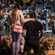 Mourners visit a memorial to those lost in a shooting at a King Soopers grocery store earlier in the week on March 27, 2021 in Boulder, Colorado. The shooting at the King Soopers Grocery on Monday left ten people dead, including one police officer.